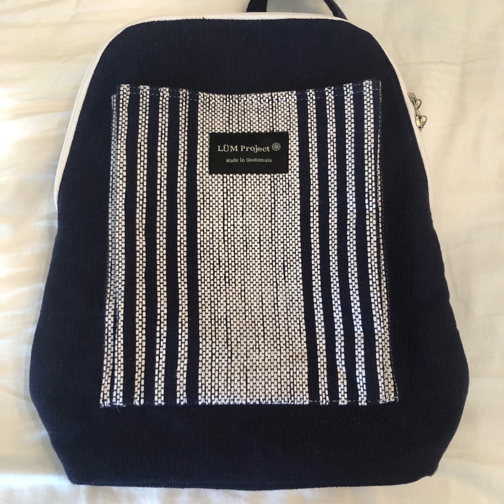 LUM PROJECT fabric backpack. Navy and white. Two zip as well as storage pockets